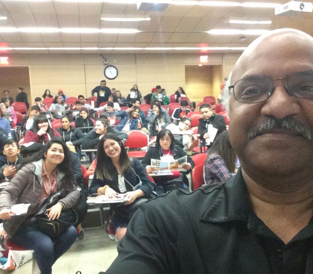 Sastry taking selfie with Juntos campers in lecture hall