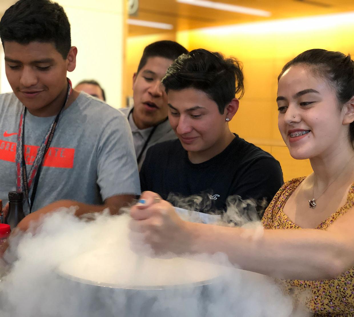 Juntos students experimenting with gas