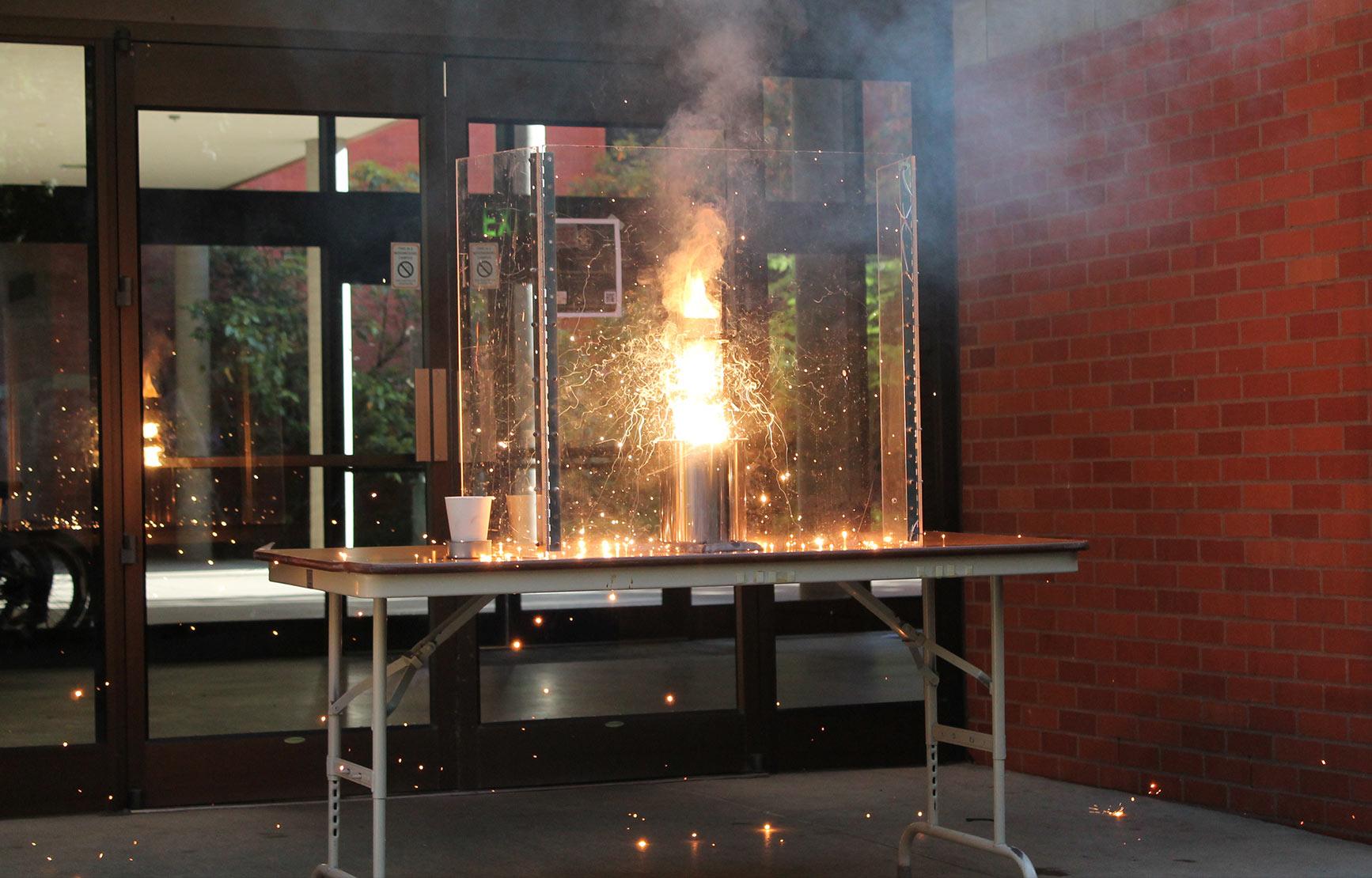 A controlled small fiery explosion during a chemistry experiment.