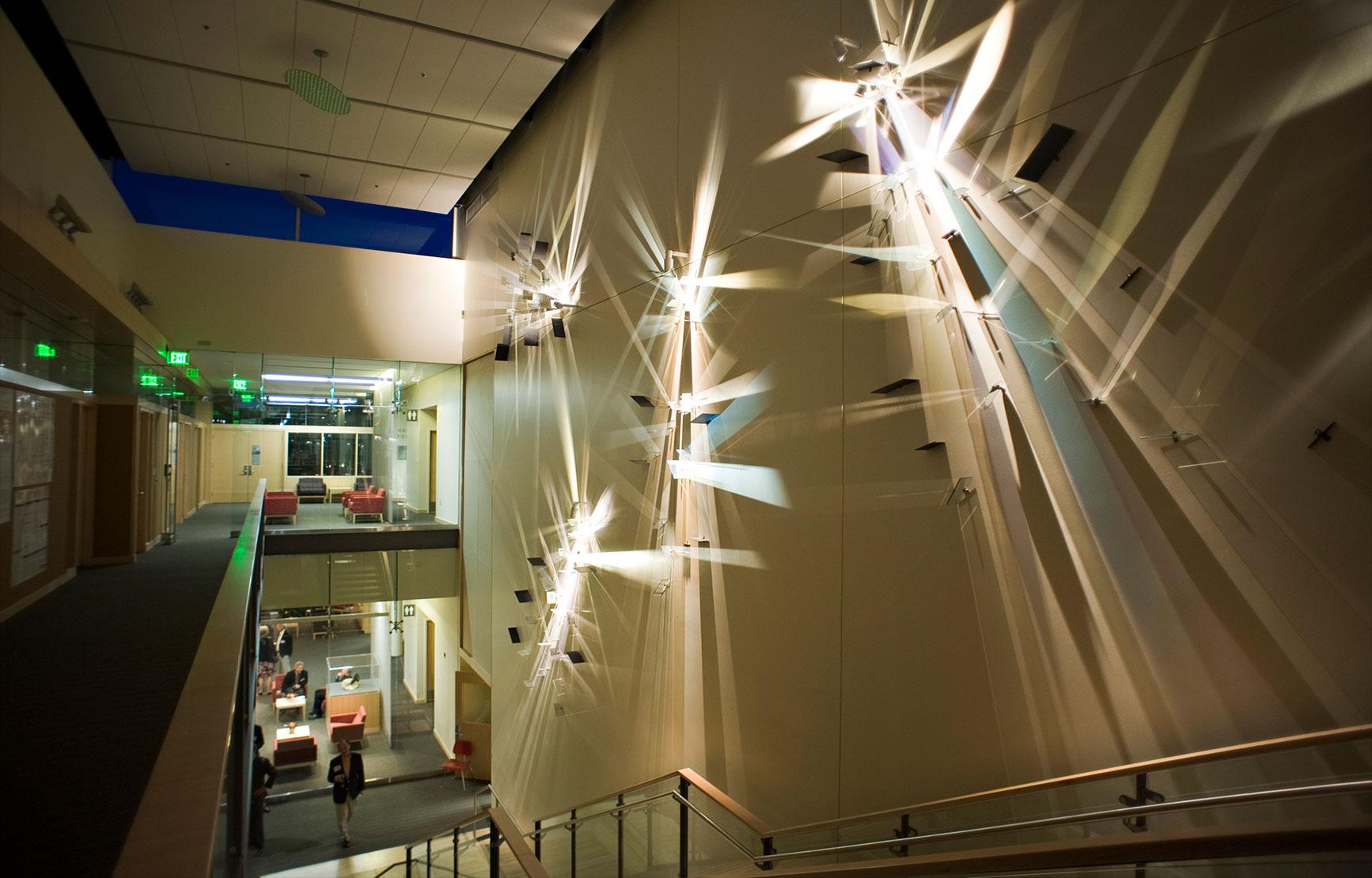 Light sculptures hanging along the stairs of the Linus Pauling Science Center.