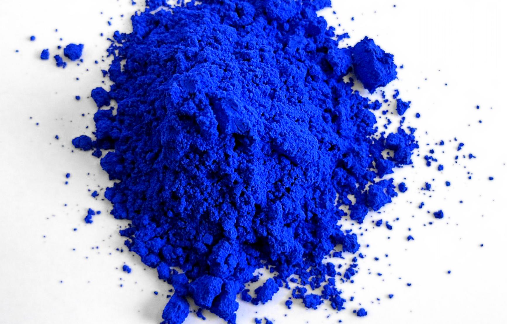 A pile of blue powder on a white table
