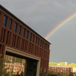 A rainbow peering behind Austin Hall.
