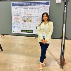Student Sachindee with her research poster presentation.