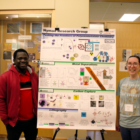 Doctor Stephen and Karlie Bach with their poster presentation.