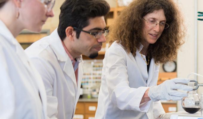 May Nyman instructing students in her lab