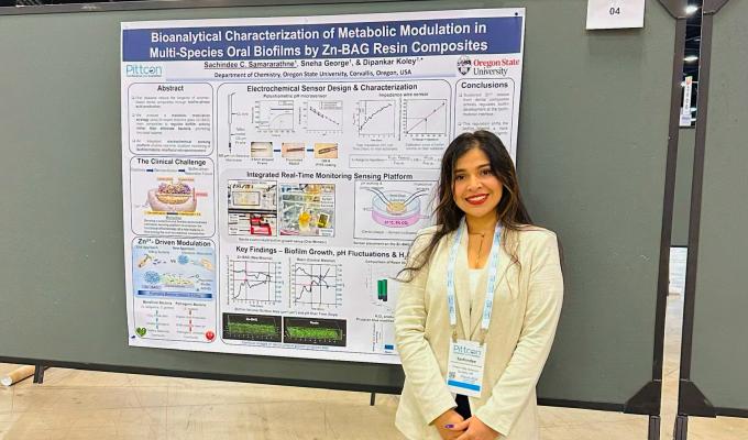Student Sachindee with her research poster presentation.