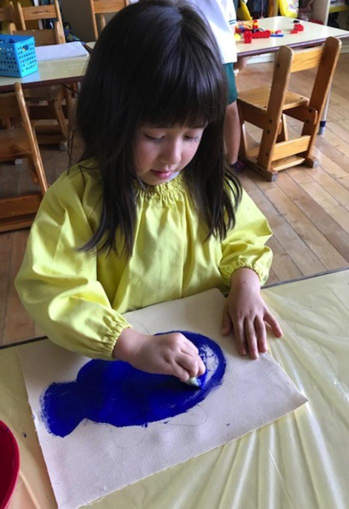 Child in soma drawing with YInMn Blue