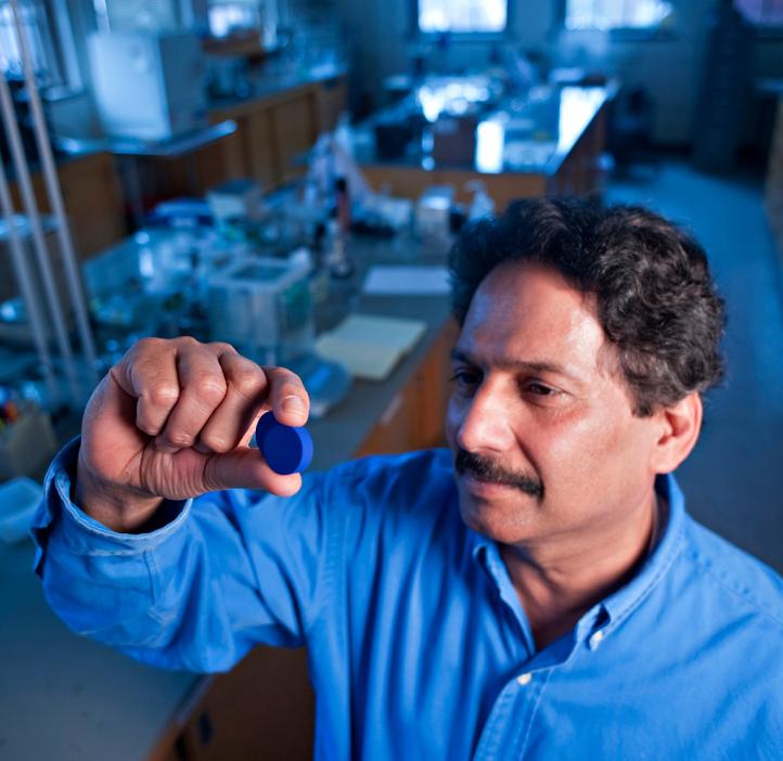 Dr. Mas Subramanian analyzing blue pigment in chemistry lab