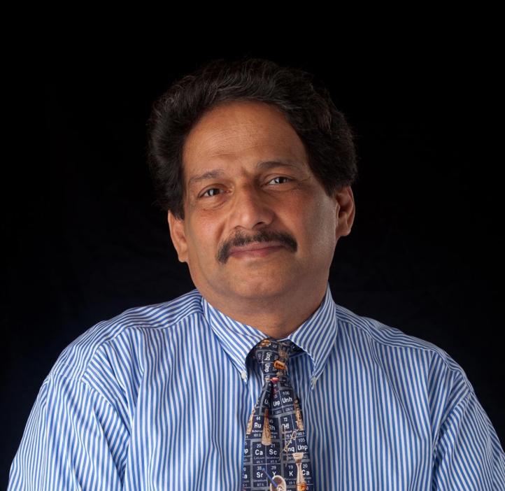 Mas Subramanian standing in front of black backdrop