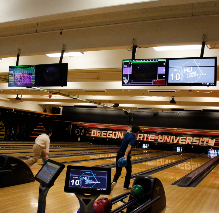 Sophia Bailey and Xiulei "David" Ji bowling.
