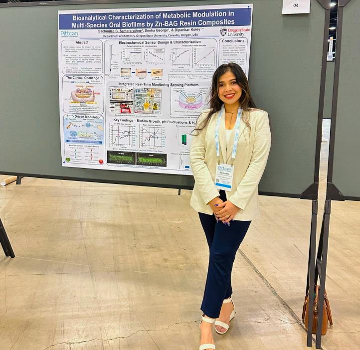 Student Sachindee with her research poster presentation.